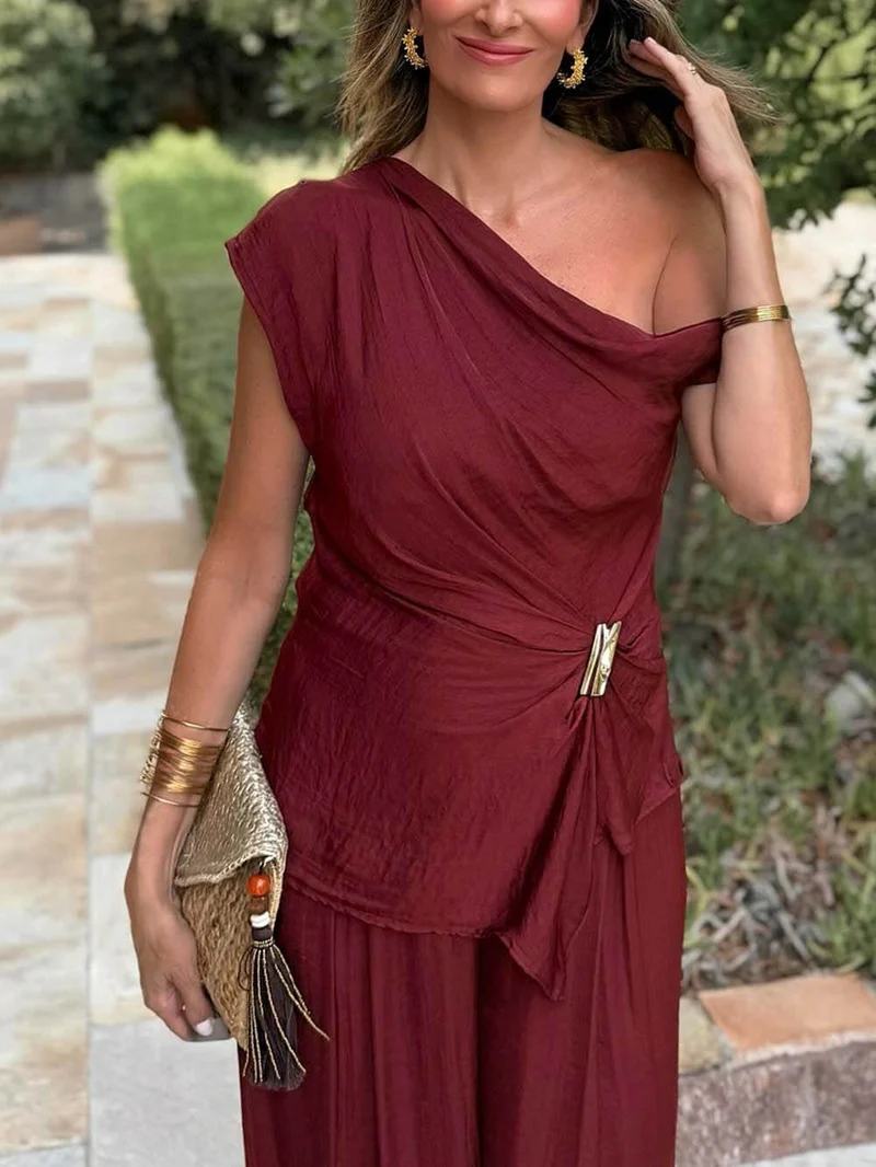 Unique Asymmetric Hem Metallic Accents Top